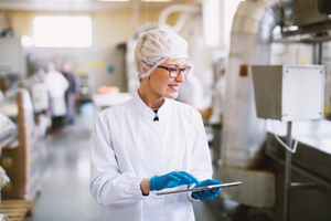 woman in lab with tablet