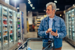 man shopping in supermarket