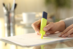 hand holding highlighter pen