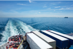 ferry at sea with trucks on board