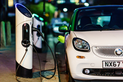 Image of electric vehicle charging at a charge point