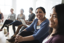 two smiling women in meeting