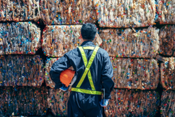 man looking at plastic waster